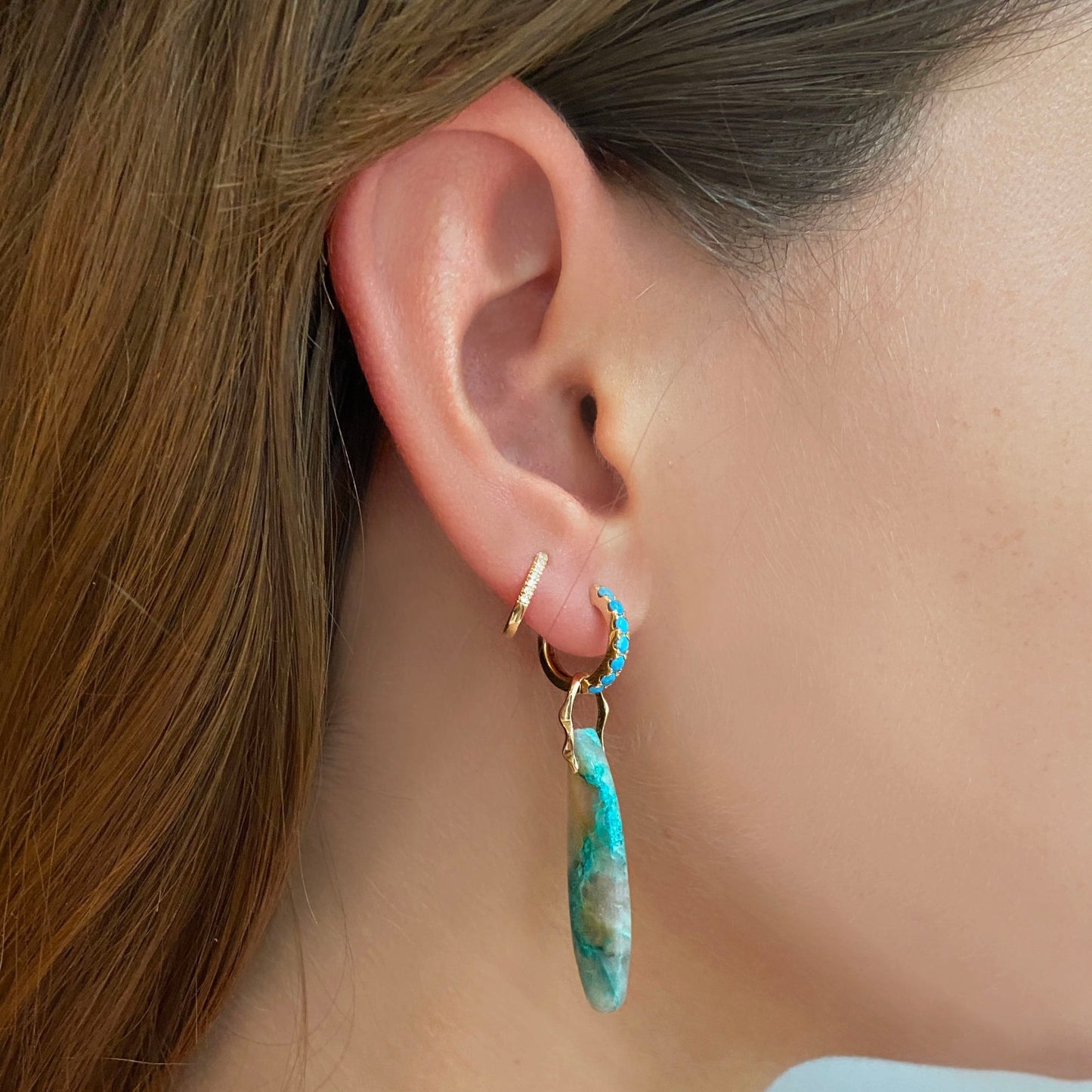 Chrysocolla in Quartz Surfboard Charm. Styled on a ear hanging from a turquoise pave hoop