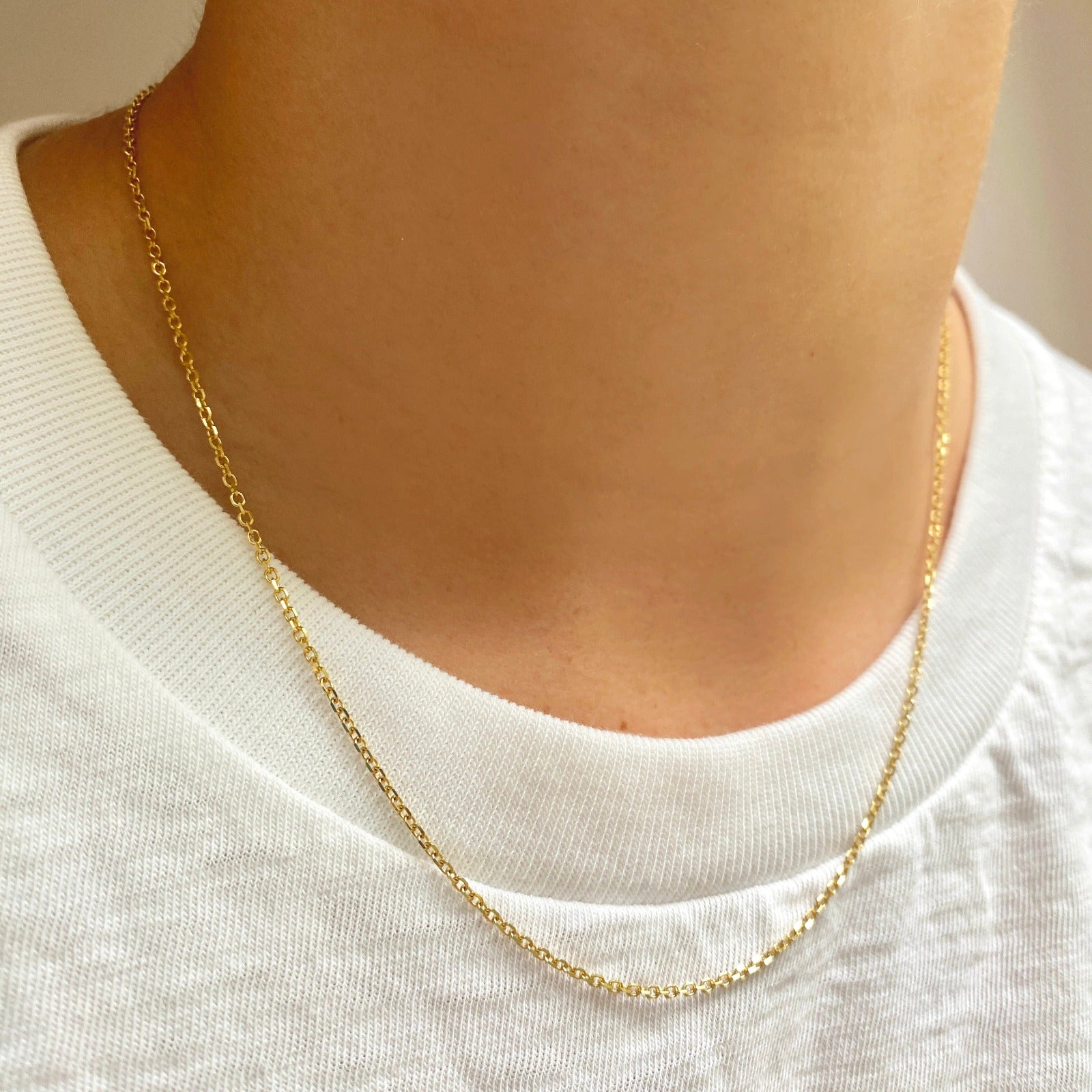 14k gold Diamond Cut Cable Chain Necklace styled on a neck
