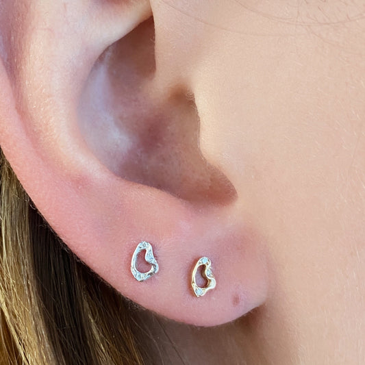 Demi Pave Small Ripple Stud Earrings styled on a ear