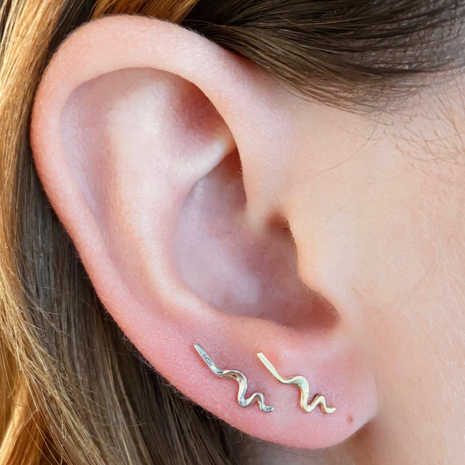Plain Small Ripple Climber Earrings styled on a ear 