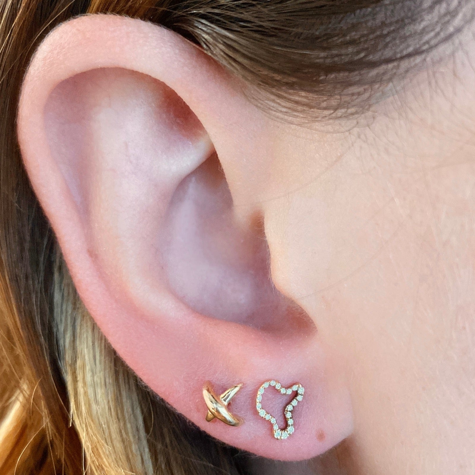 14k gold Full Pave Ripple Stud Earring. Styled on a ear with a stitch stud earring