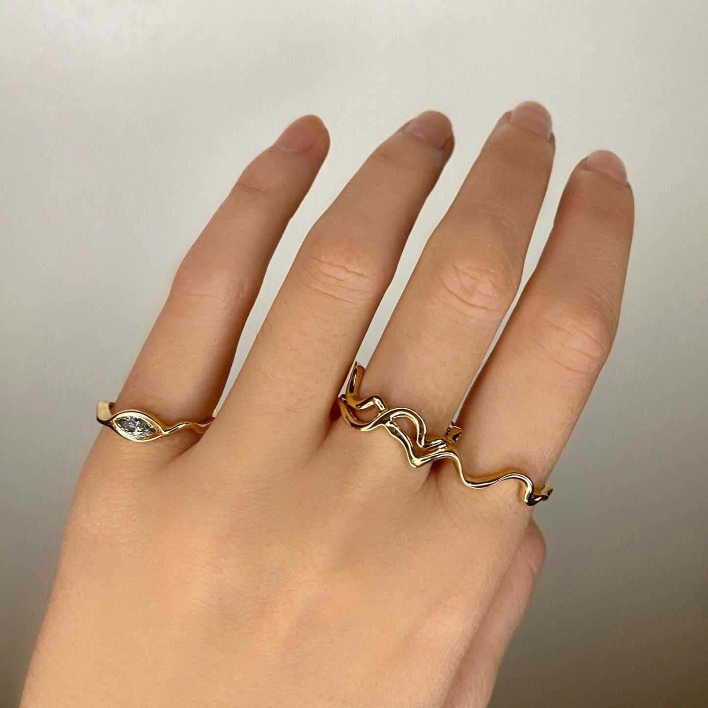 14k gold Double Finger Ripple Ring styled on a hand