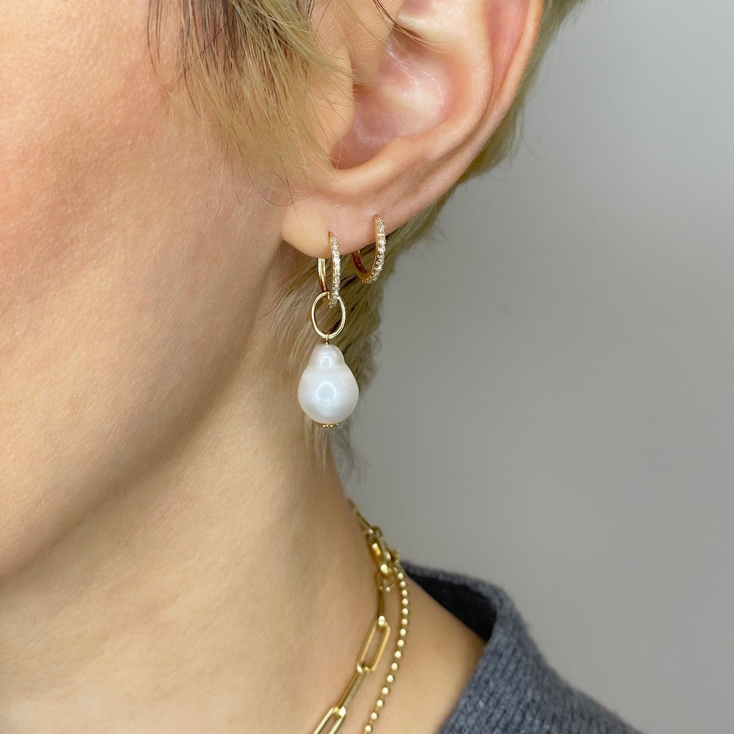 14k gold 12mm Diamond Pavé Hoop Earrings styled on a ear