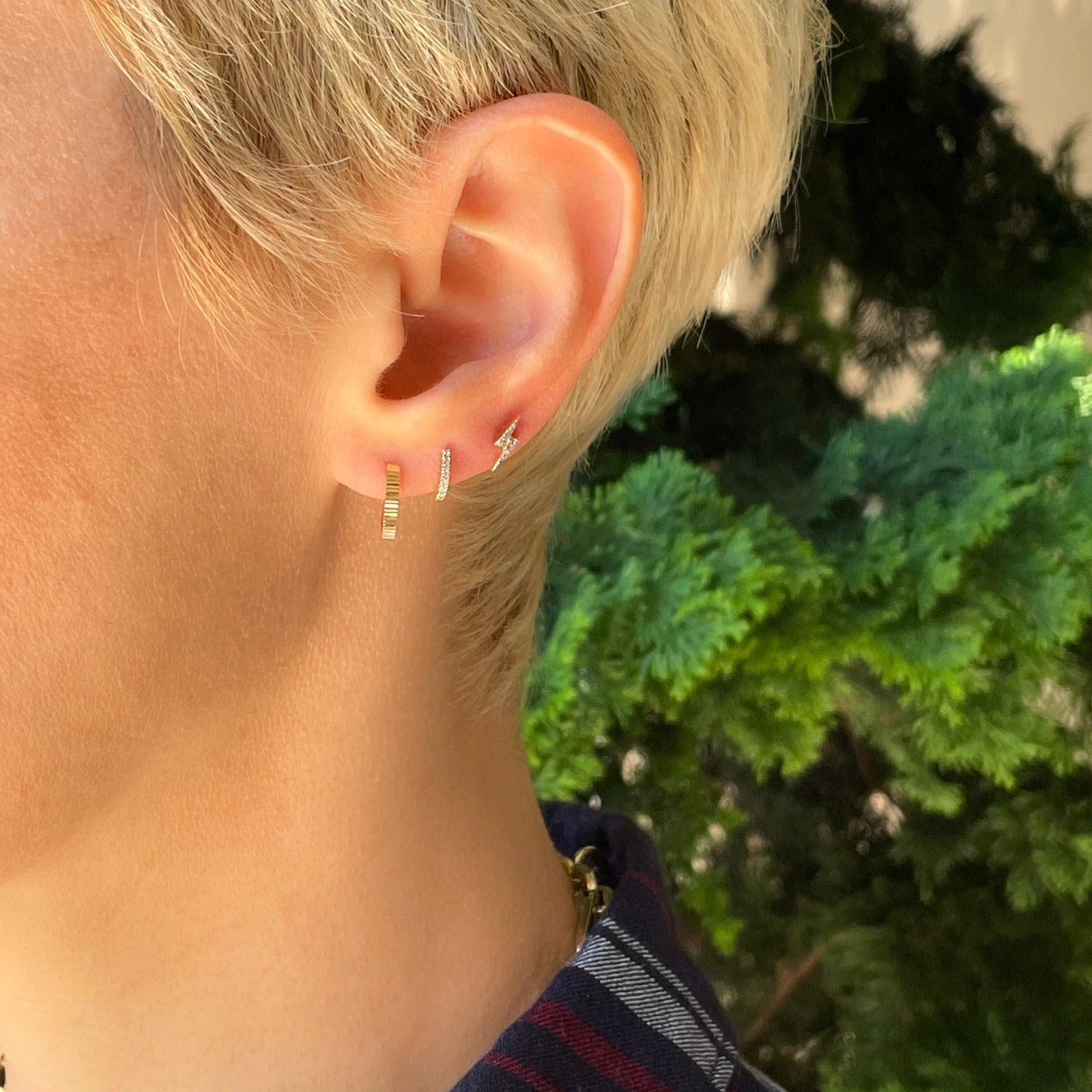 14k gold 9mm Diamond Pavé Hoop Earrings styled on a ear
