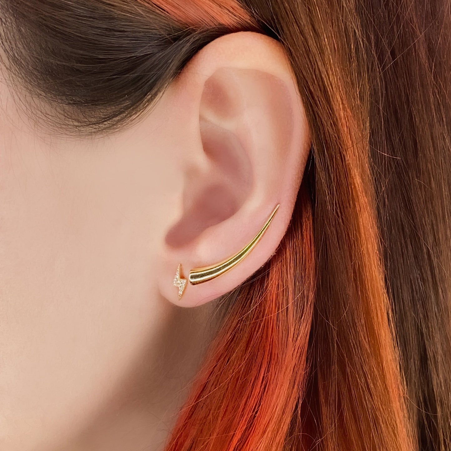 14k gold Curved Quill Climber Earrings styled on a ear