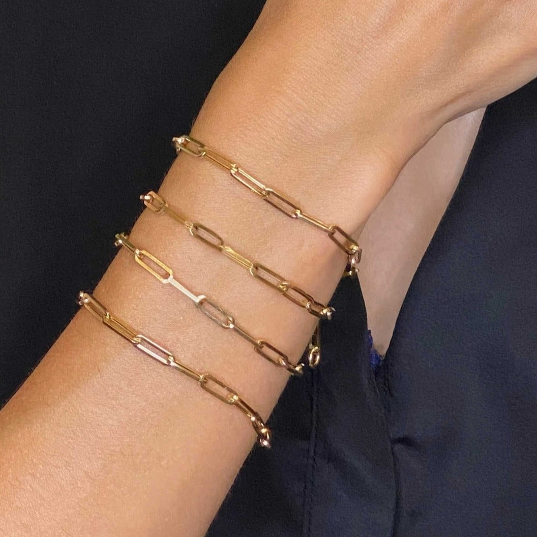 14k gold Chunky Paperclip Chain Bracelet with a lobster clasp styled on a wrist