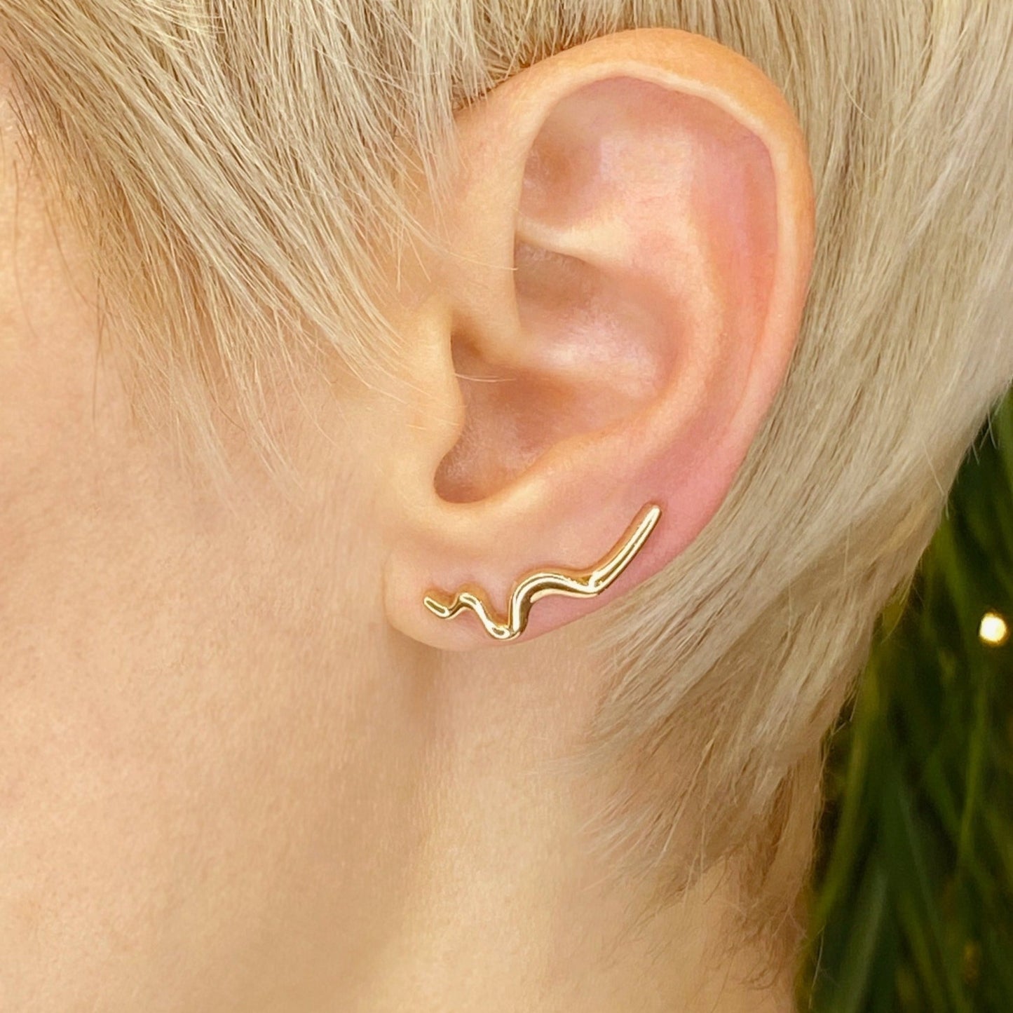 14k gold Plain Large Ripple Climber Earring styled on a ear