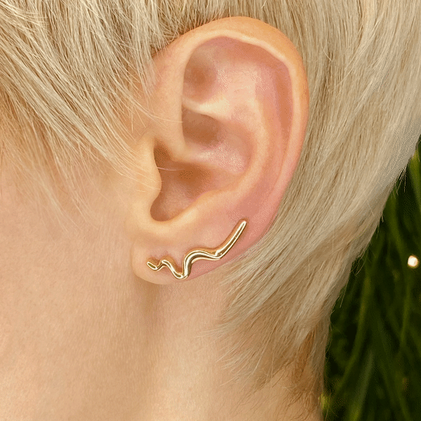 14k gold Plain Large Ripple Climber Earring styled on a ear gif