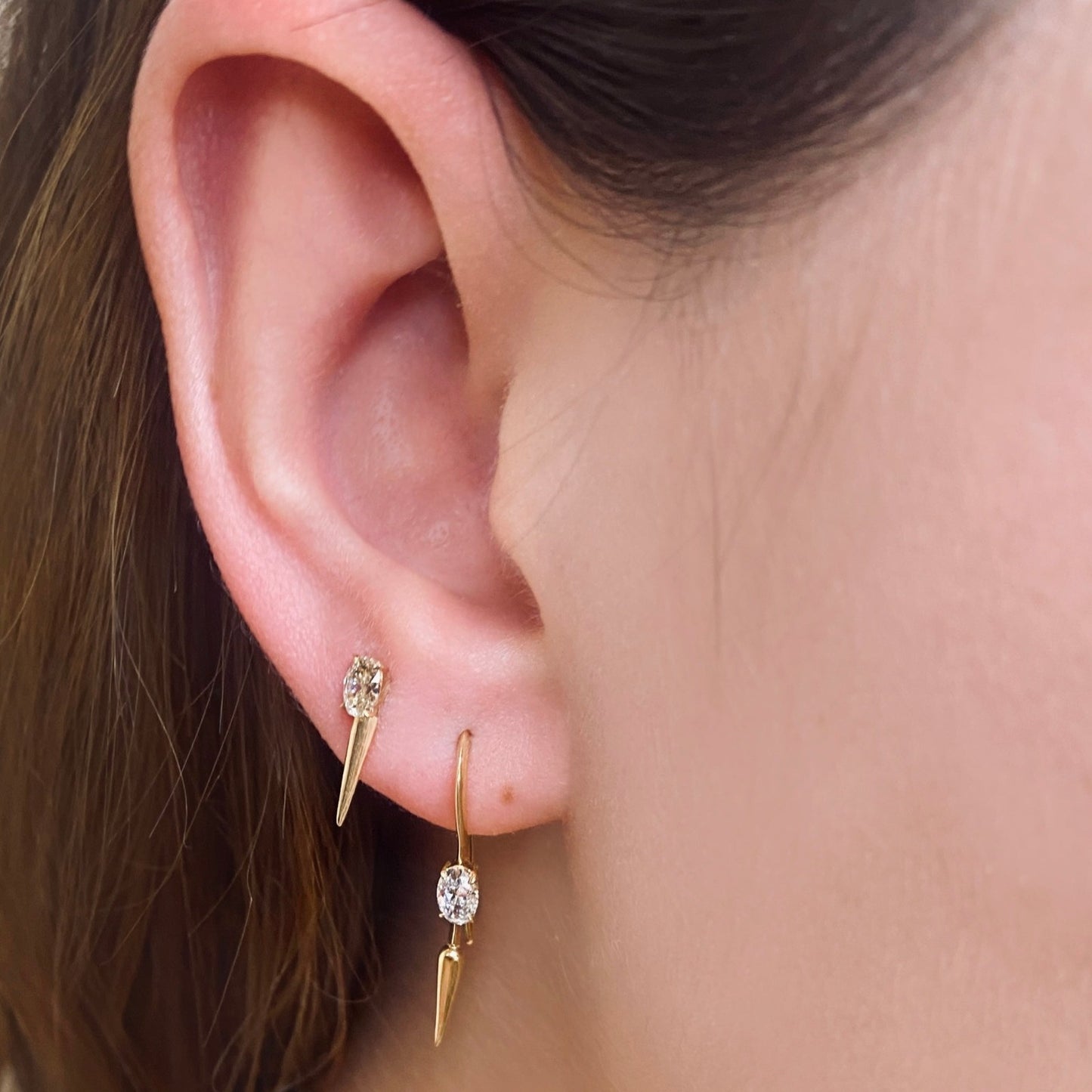14k gold Single Diamond Drop Earrings styled on a ear