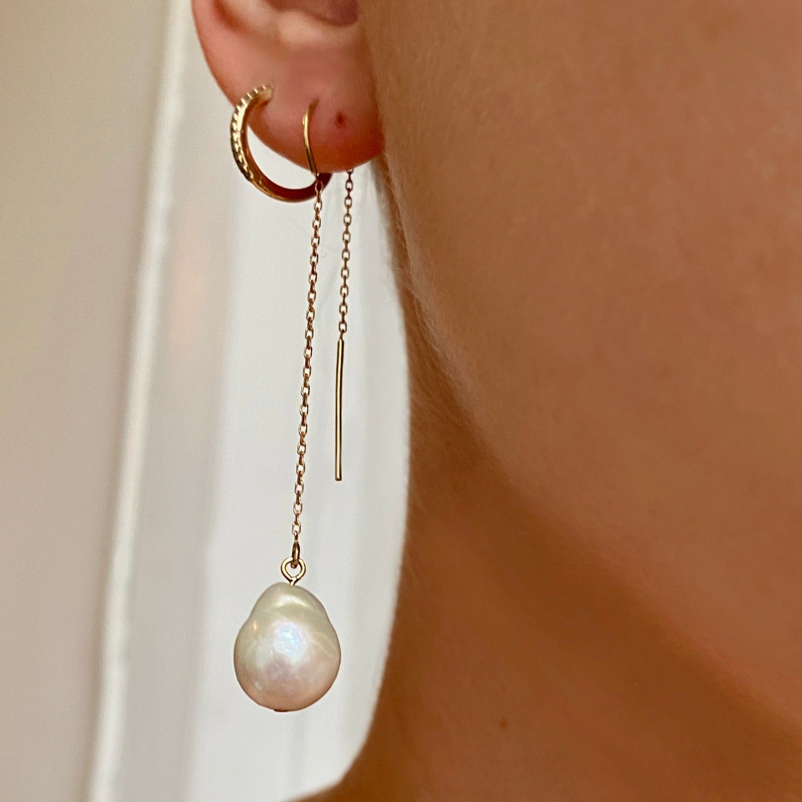14k gold Mini Baroque Pearl Ear Threader styled on a ear