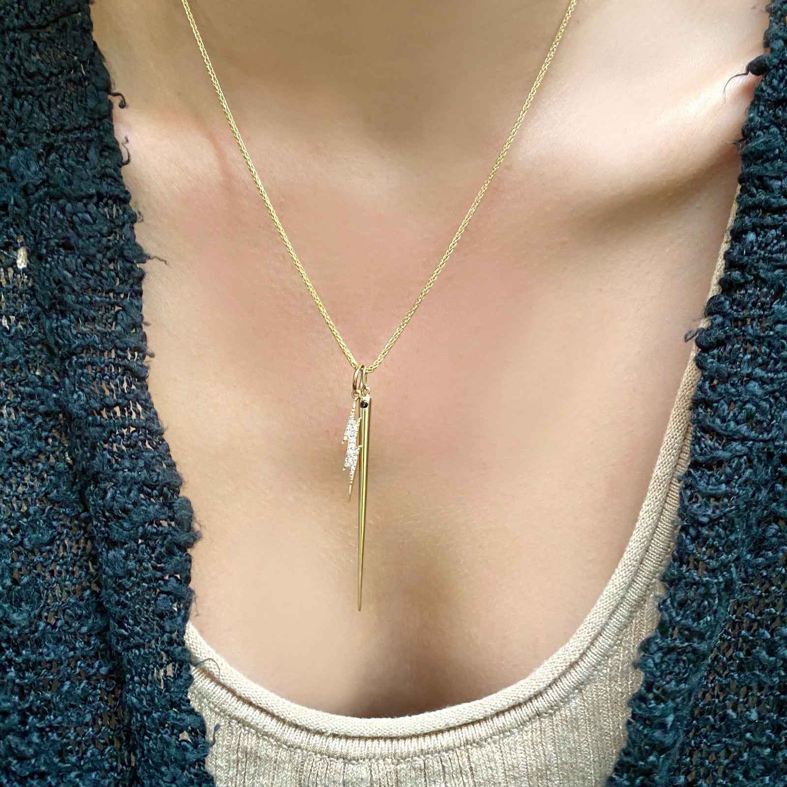 14k gold Wheat Chain Necklace. Styled on a neck with a quill spike charm