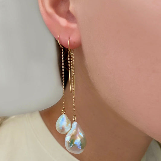 14k gold Mini Baroque Pearl Ear Threaders styled on a ear