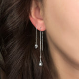 AMANDA PEARL recycled sterling silver molten ear threaders on a model's ear.