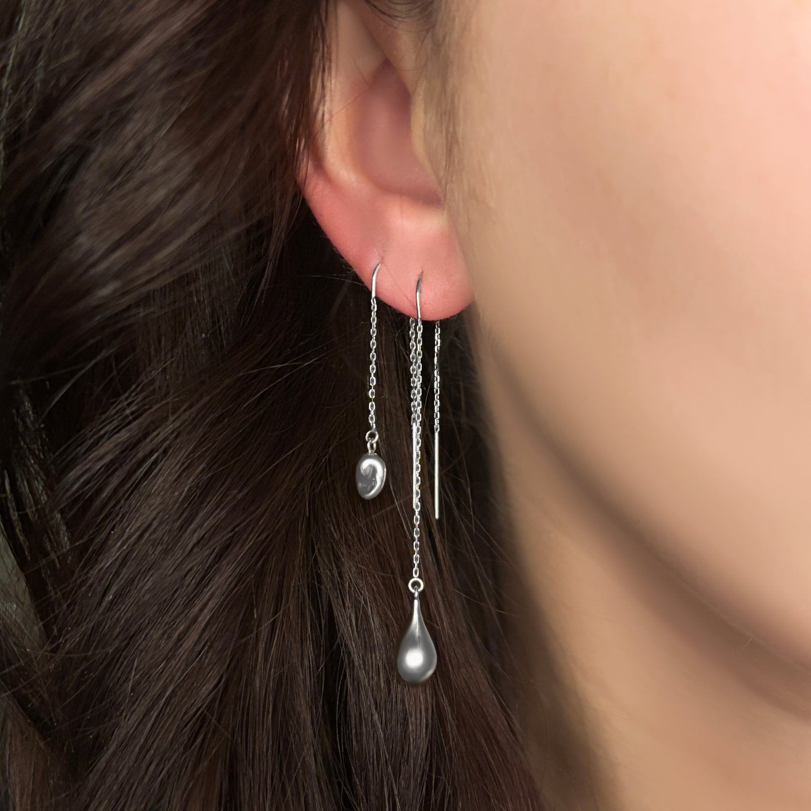 AMANDA PEARL recycled sterling silver molten ear threaders on a model's ear.