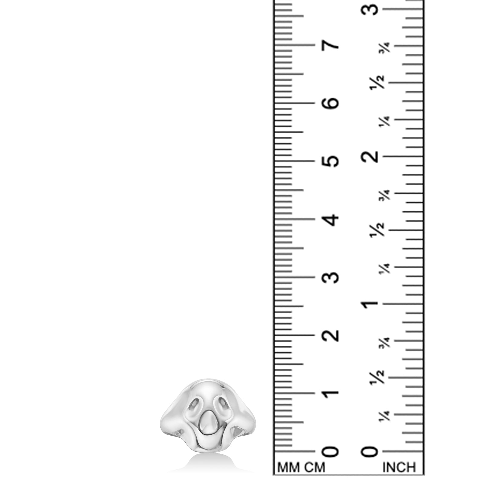AMANDA PEARL Molten Skull Pinky Ring in recycled sterling silver on a white background next to a ruler.