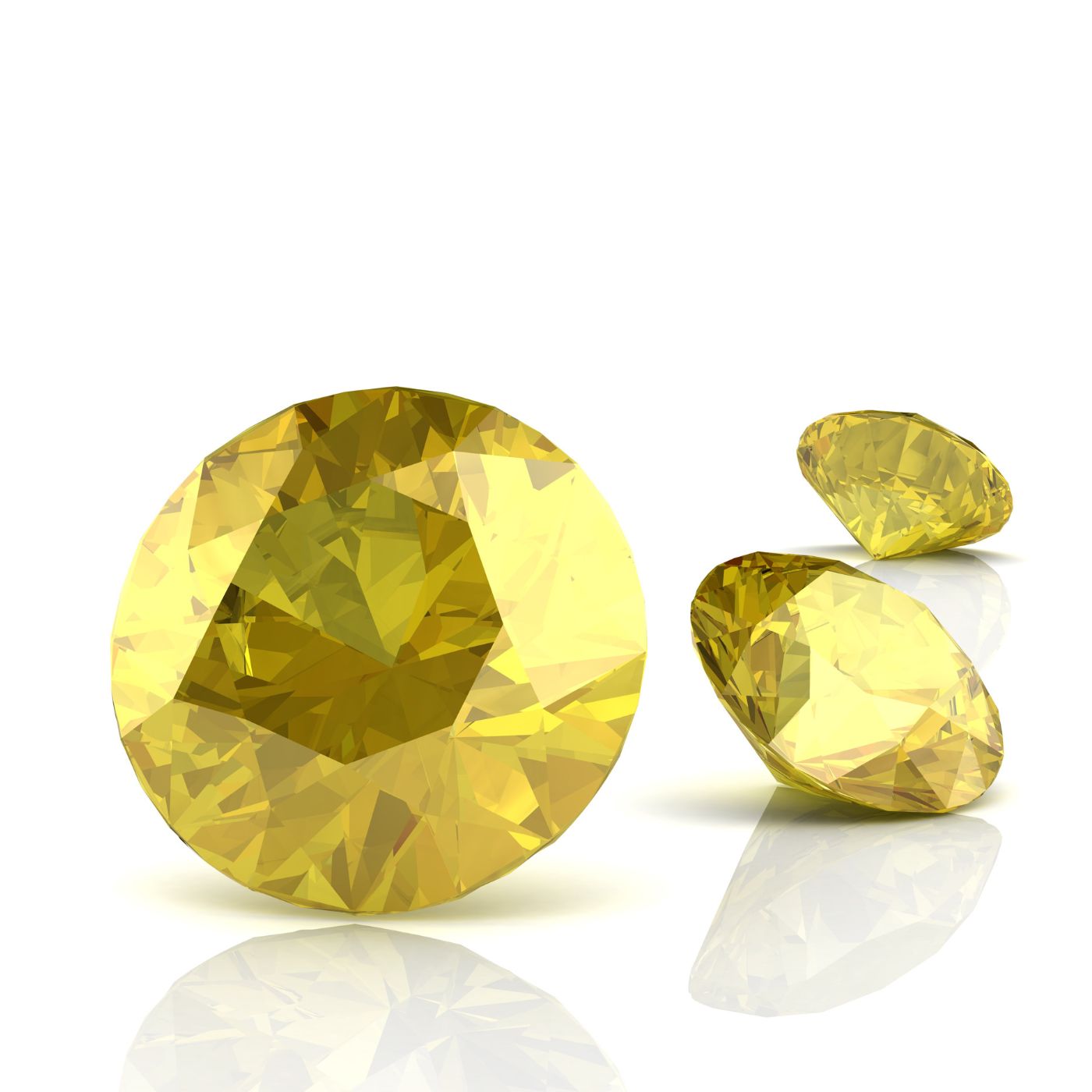 Three yellow sapphire gemstones of different cuts arranged on a white reflective surface, with the largest round faceted stone in the foreground and two smaller stones behind it.