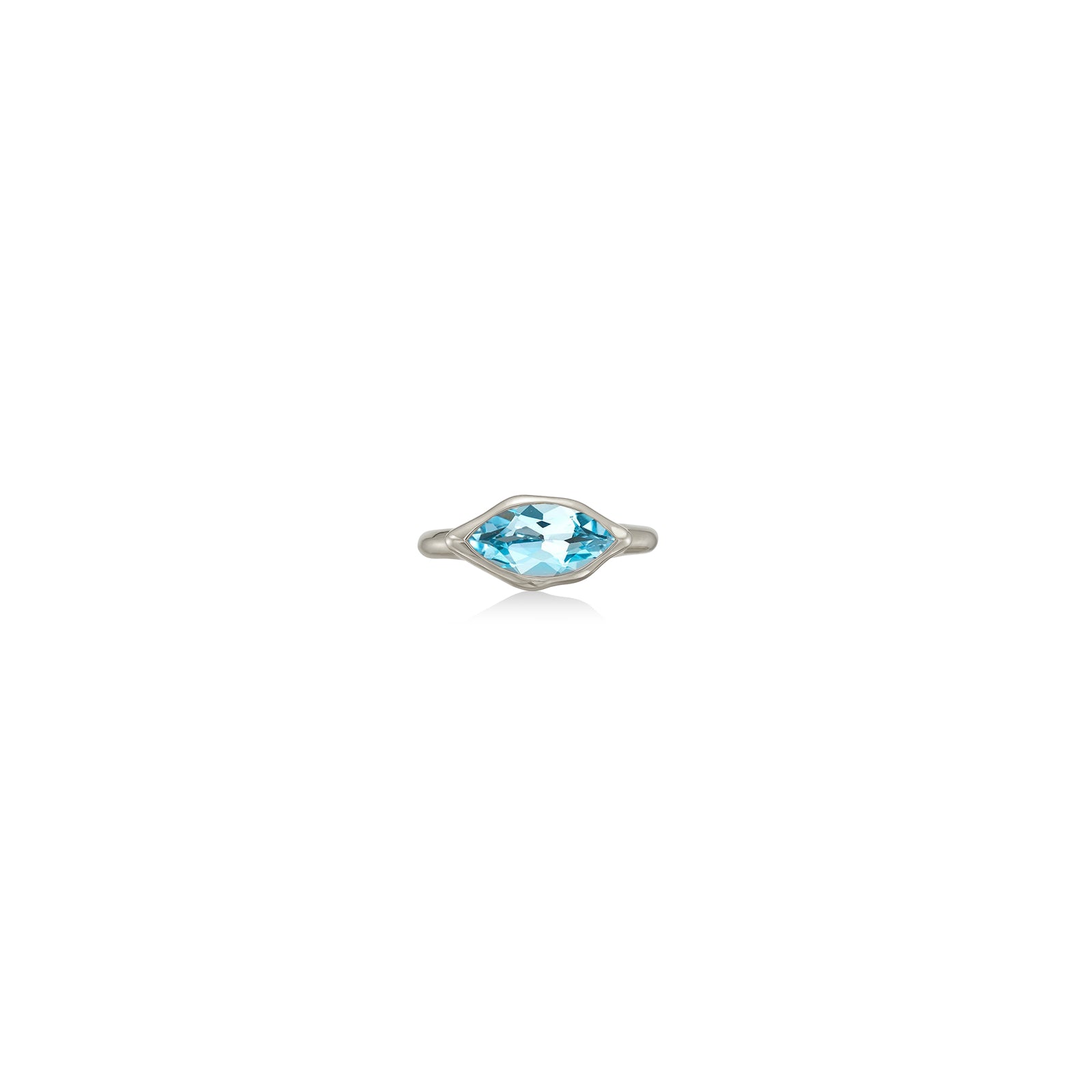 A 14K white gold marquise ring, with a bezel set faceted blue topaz gemstone, sits on a white background with drop shadow.