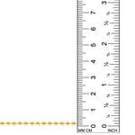 This image displays a 14k gold chain, set against a white backdrop, being compared to a ruler, demonstrating that the beads are 3mm in size.