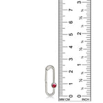 14K white gold charm lock with a ruby stone, set against a ruler for scale, on a white background.