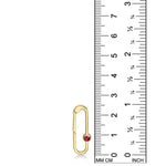 14K yellow gold charm lock with a ruby stone, set against a ruler for scale, on a white background.