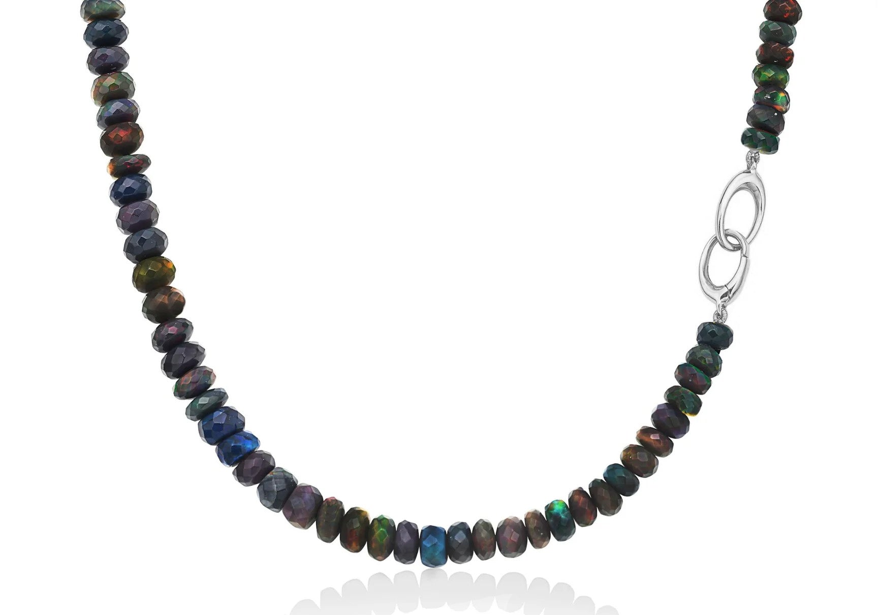 An AMANDA PEARL night sky opal necklace is captured hanging it's sterling silver evolution clasp shown off to the side. 