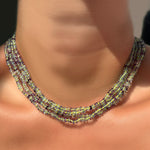 Faceted Fluorite on Neon layered on the neck.