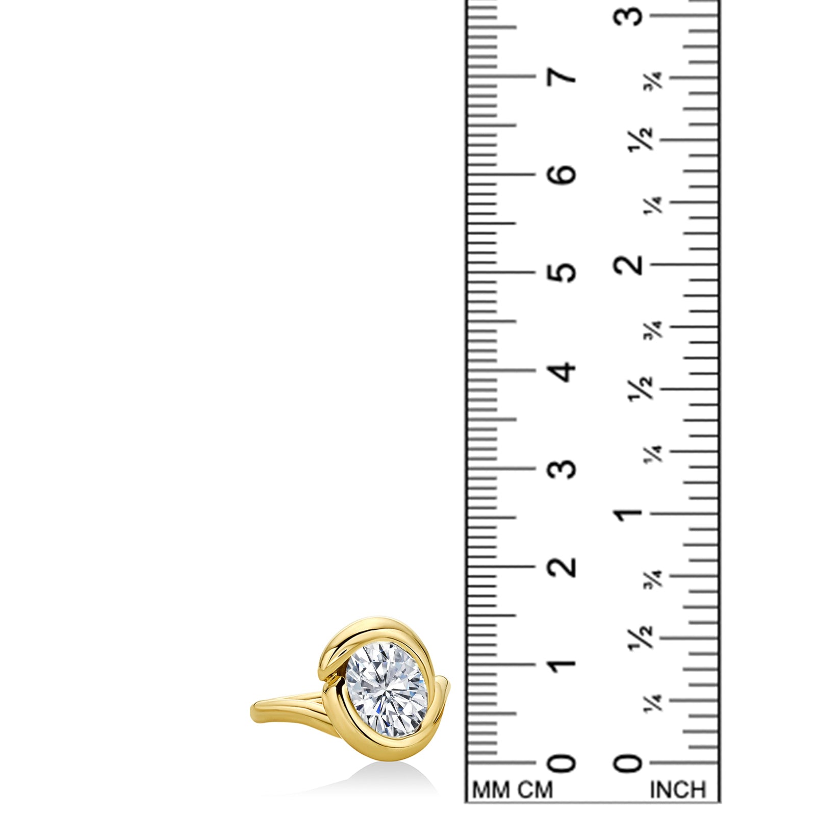 A diamond ring set with a lab grown diamond and cast in 14k yellow gold. The ruler demonstrates that the piece is 1.5cm and provides scale to the photo.