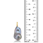 AMANDA PEARL Pale grey baroque pearl with a yellow gold ripple bale on a white background next to a ruler.