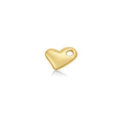 A 14K recycled yellow gold molten heart charm from AMANDA PEARL, sits front facing on a white background with drop shadow.