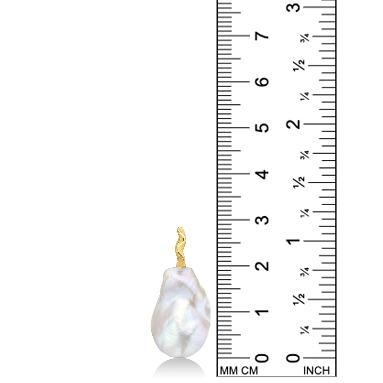 An AMANDA PEARL medium white baroque pearl against a ruler showing it's height to 29mm tall. It has a unique 14K recycled yellow gold ripple bale. 