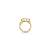 side view oval molten diamond solitaire ring in yellow gold against a white background