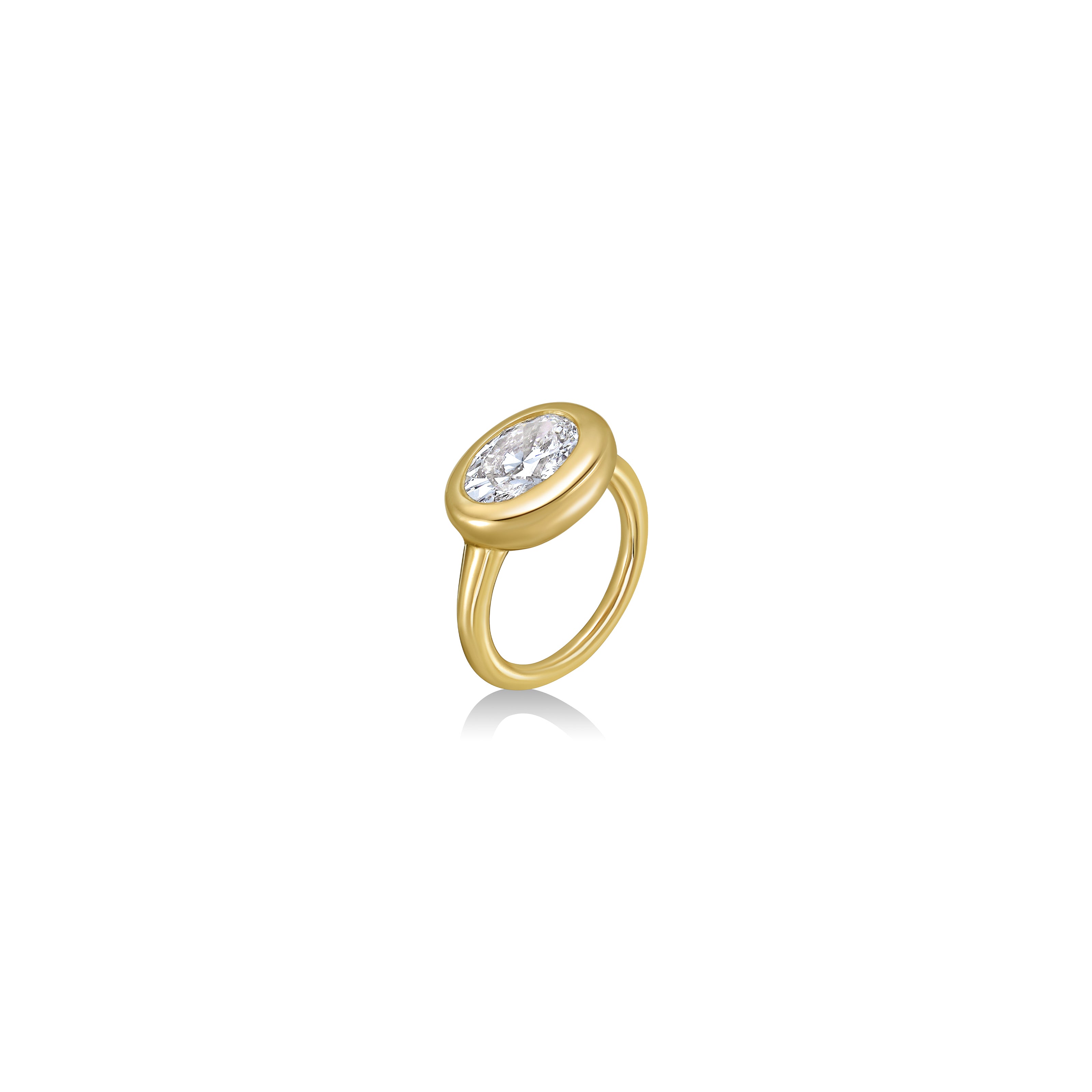 Tilt view of oval molten diamond solitaire ring in yellow gold against a white background
