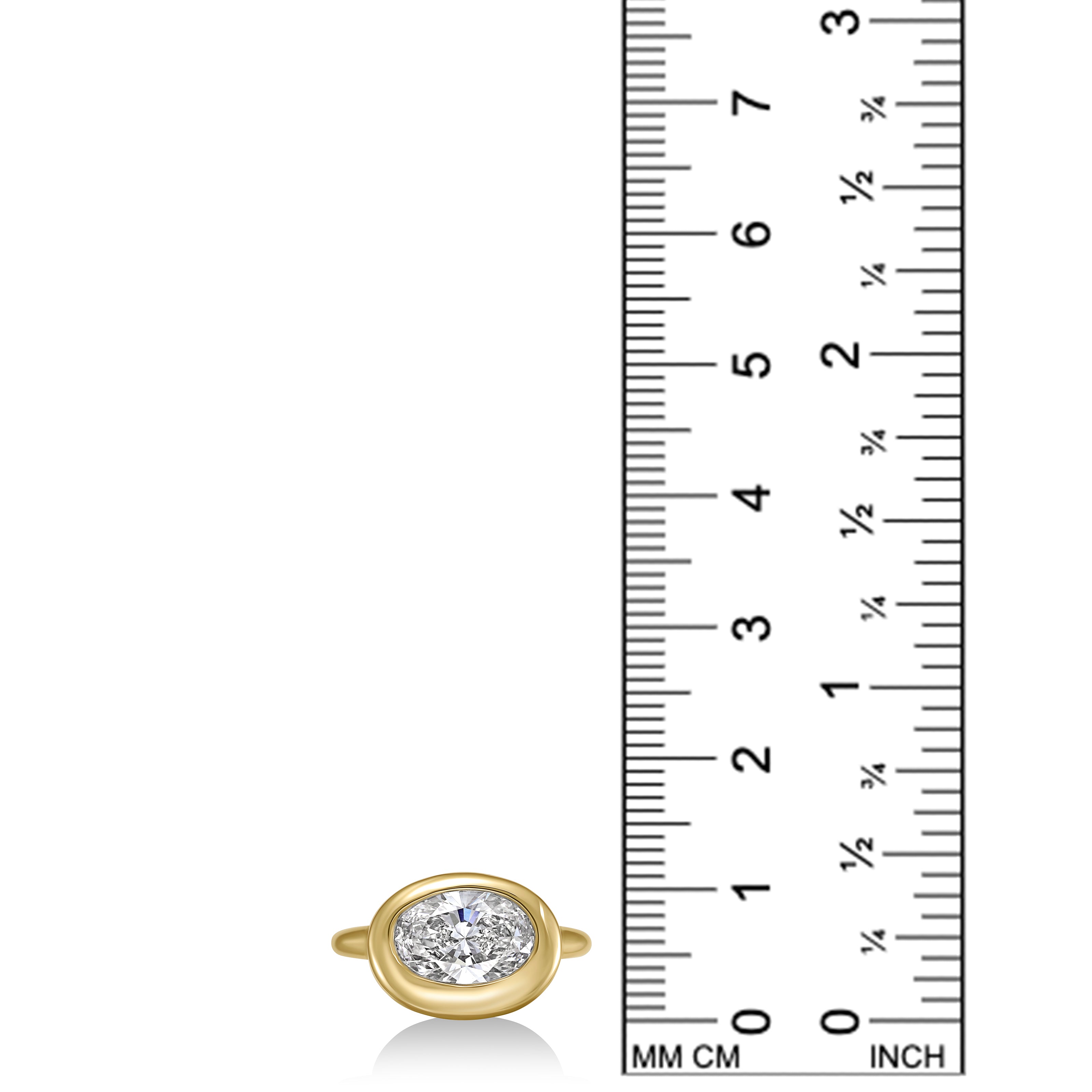 front view oval molten diamond solitaire ring in yellow gold against a ruler