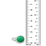 A recycled sterling silver ring with an oval chrysoprase cabochon gemstone, shown next to a black ruler with millimeter and inch markings to indicate its size.