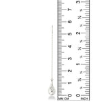 An AMANDA PEARL molten drop threader earring cast in recycled sterling silver against a ruler showing its height to be 58mm high.