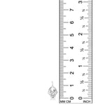 AMANDA PEARL Molten Skull Charm in recycled sterling silver on a white background next to a ruler.