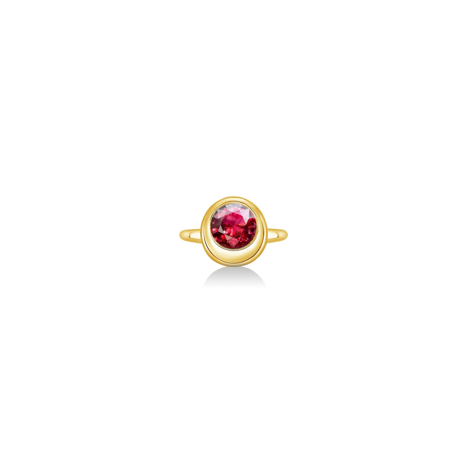 Molten solitaire ring in recycled 14k yellow gold with a round, cultivate ruby on a white background. 