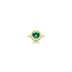 Molten solitaire ring in recycled 14k yellow gold with a round, cultivated emerald on a white background. 