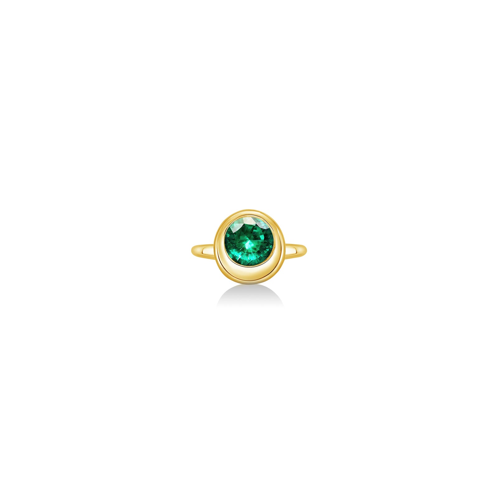 Molten solitaire ring in recycled 14k yellow gold with a round, cultivated emerald on a white background. 