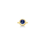 Molten solitaire ring in recycled 14k yellow gold with a round, cultivate sapphire on a white background. 