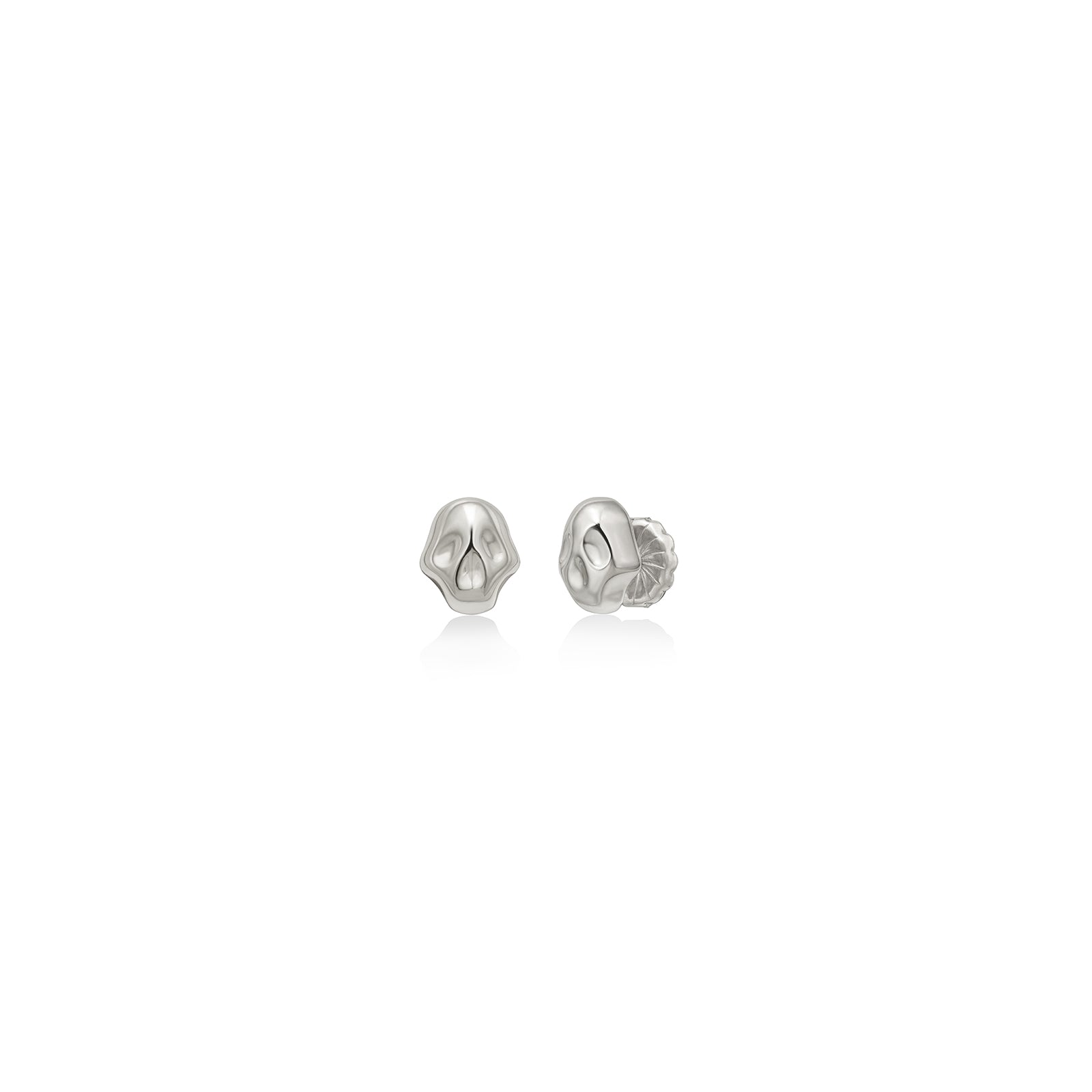 AMANDA PEARL Molten skull studs in recycled sterling silver on a white background.