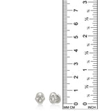 AMANDA PEARL Molten skull studs in recycled sterling silver on a white background next to a ruler.