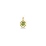 Molten Solitaire Charm in recycled 14k yellow gold with a peridot on a white background.