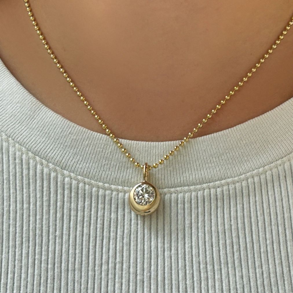 14K Recycled Gold Molten Round Solitaire Charm with Diamond layered on a 2mm bead chain on neck