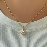 14K Recycled Gold Molten Round Solitaire Charm with Diamond layered on a 2mm bead chain on neck