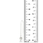 An AMANDA PEARL molten droplet threader earring cast in recycled sterling silver against a ruler showing its height to be 38mm high.
