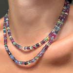 A 16" and 18" strand of Night Fever Faceted Sapphires layered on a model's neck.