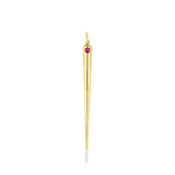 A quill spike charm cast in recycled yellow gold with a bezel set lab grown ruby, on a white background. 