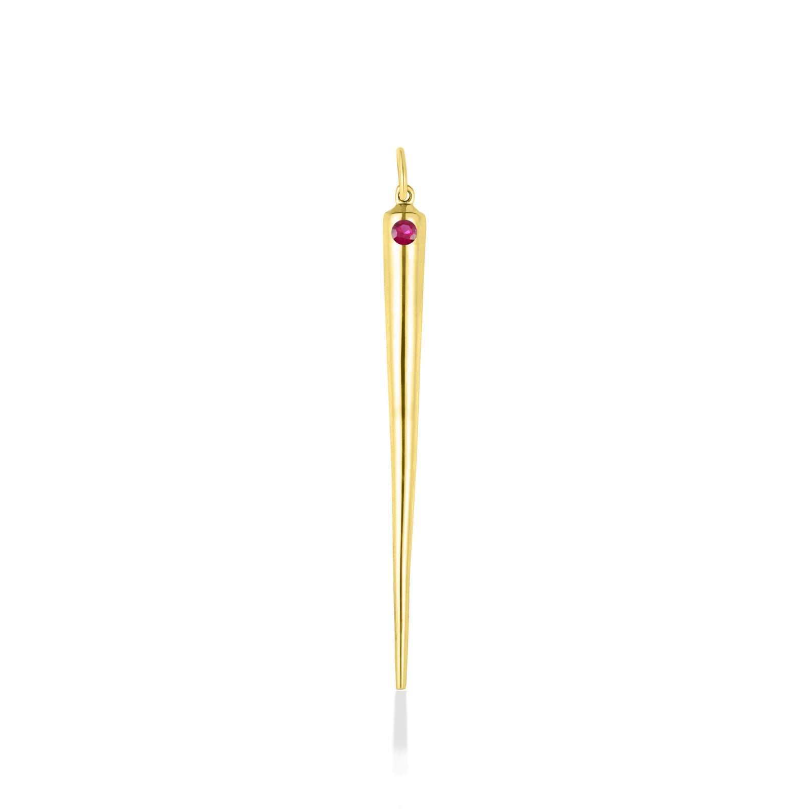 A quill spike charm cast in recycled yellow gold with a bezel set lab grown ruby, on a white background. 