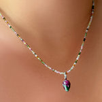 Ruby Zoisite Drop Charm and tourmaline slim gemstone necklace on the neck.